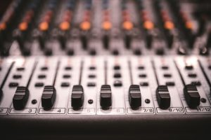 Sound studio recording equipment, music mixer controls at concert or party in a night club