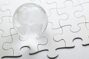 glass globe with puzzle background
