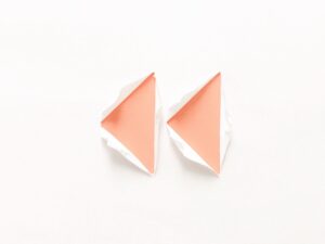 Rewind emoji torn white paper apricot triangular shaped inserts