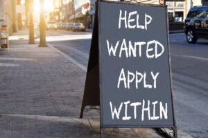 Help Wanted Sign - employers advertising job openings to hire employees for their company business