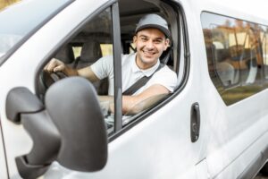 Portrait of delivery driver in the car