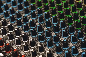 Professional Sound Mixer. Close-up view of colorful control buttons for sound adjusting in a
