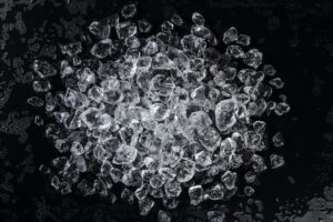 Pile of crushed ice on a black table