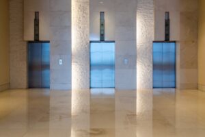 Three elevator doors interior building with low light
