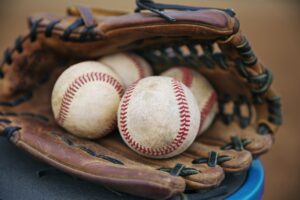 Close-up Of Baseballs In Catchers Mitt