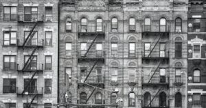 Old buildings with fire escapes in New York City.
