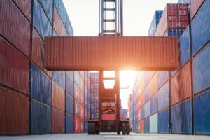 Forklift working in the container cargo yard port loading cargo, Logistic service and transportation