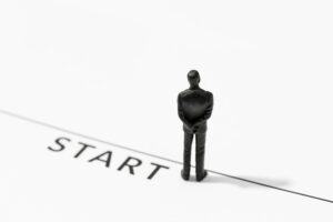 Businessman figurine on Starting line. Start, Concept of challenge or career path and change